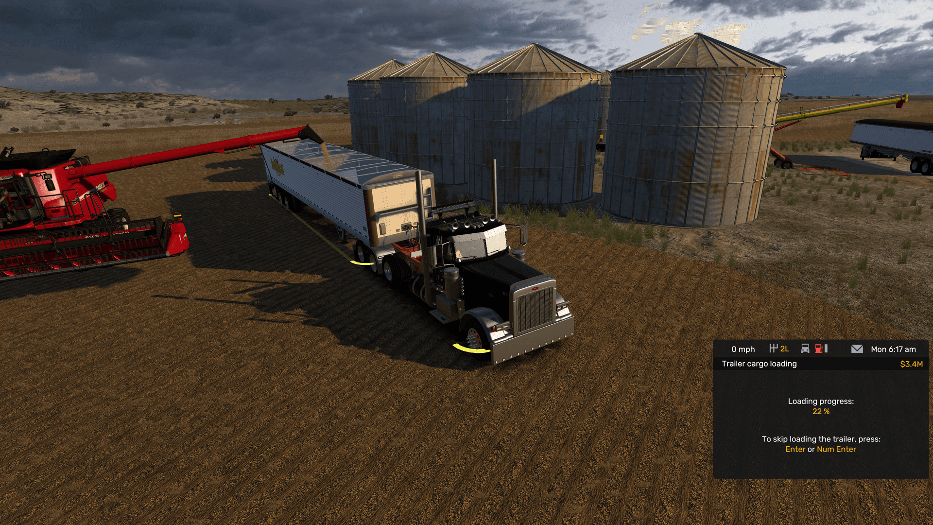 Harvester unloading into grain truck